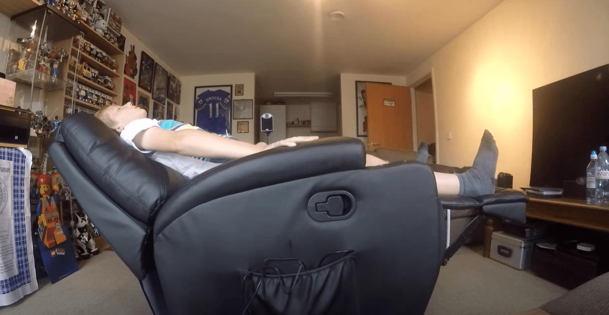 Heated-Massage-Recliners a boy is relaxing on massage chair