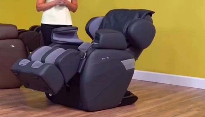 Relax-On-Chair-MK-II a woman is standing next to a massage chair