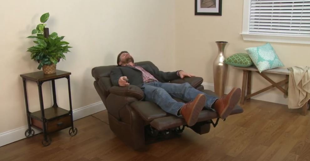 manual-vs-power-recliner a man resting on power recliner