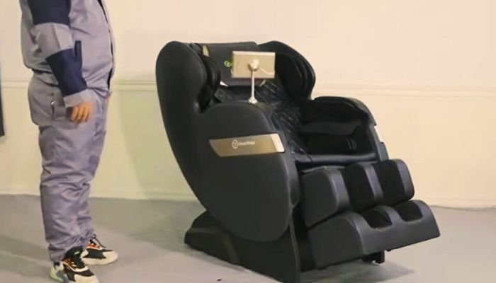 a man is standing next to massage chair